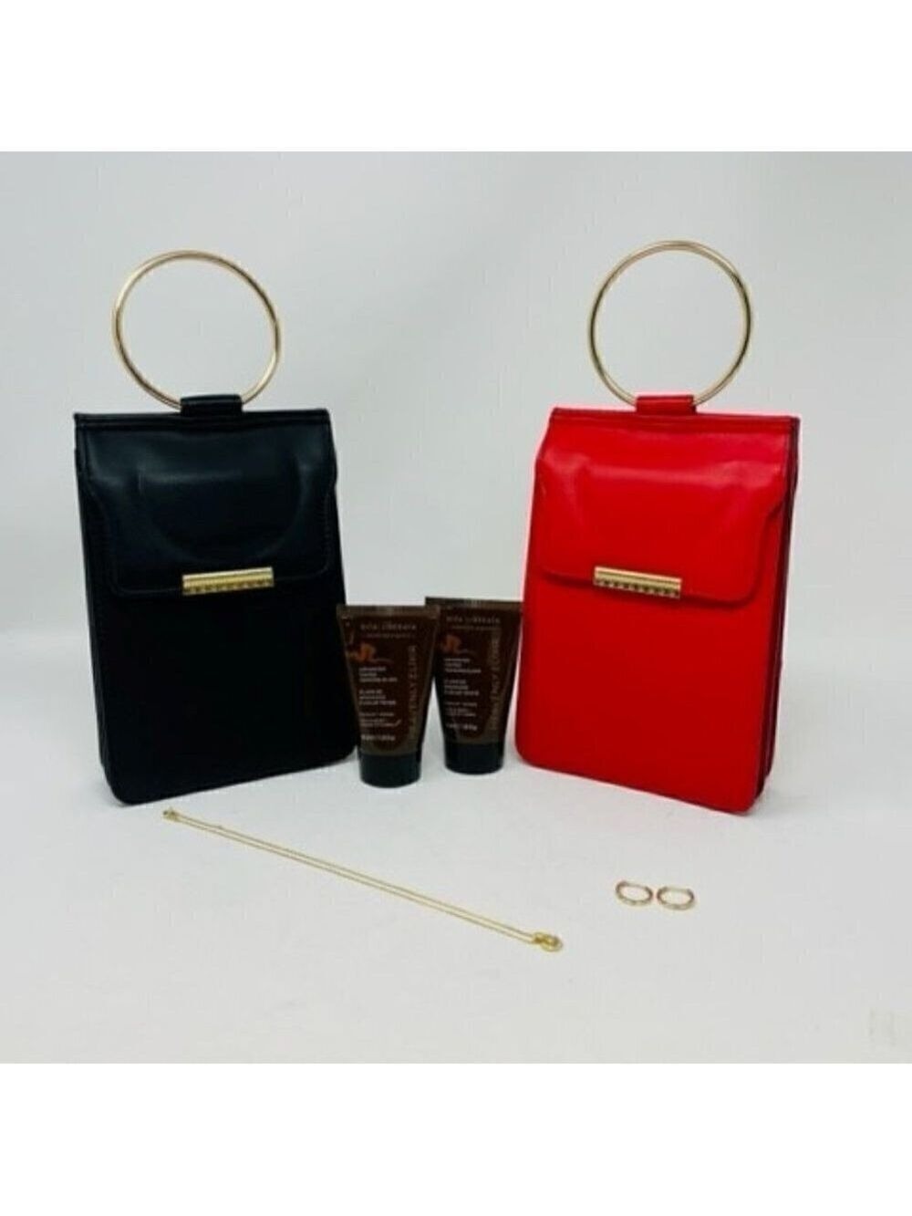 6 piece set- 2 handbags, necklace, earrings and 2 Vita Liberata Tanning Elixir